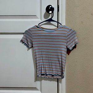 cropped orange and light blue shirt that is in good condition